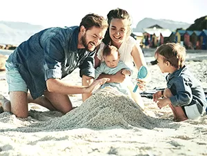 family playing beach
